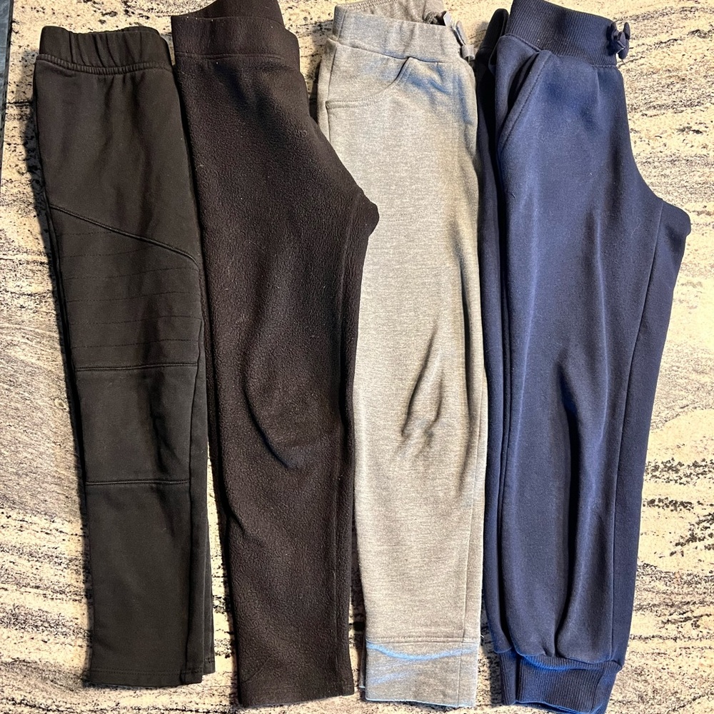 Two pairs of joggers, one pair motto leggings, one pair fleece leggings 5/6
